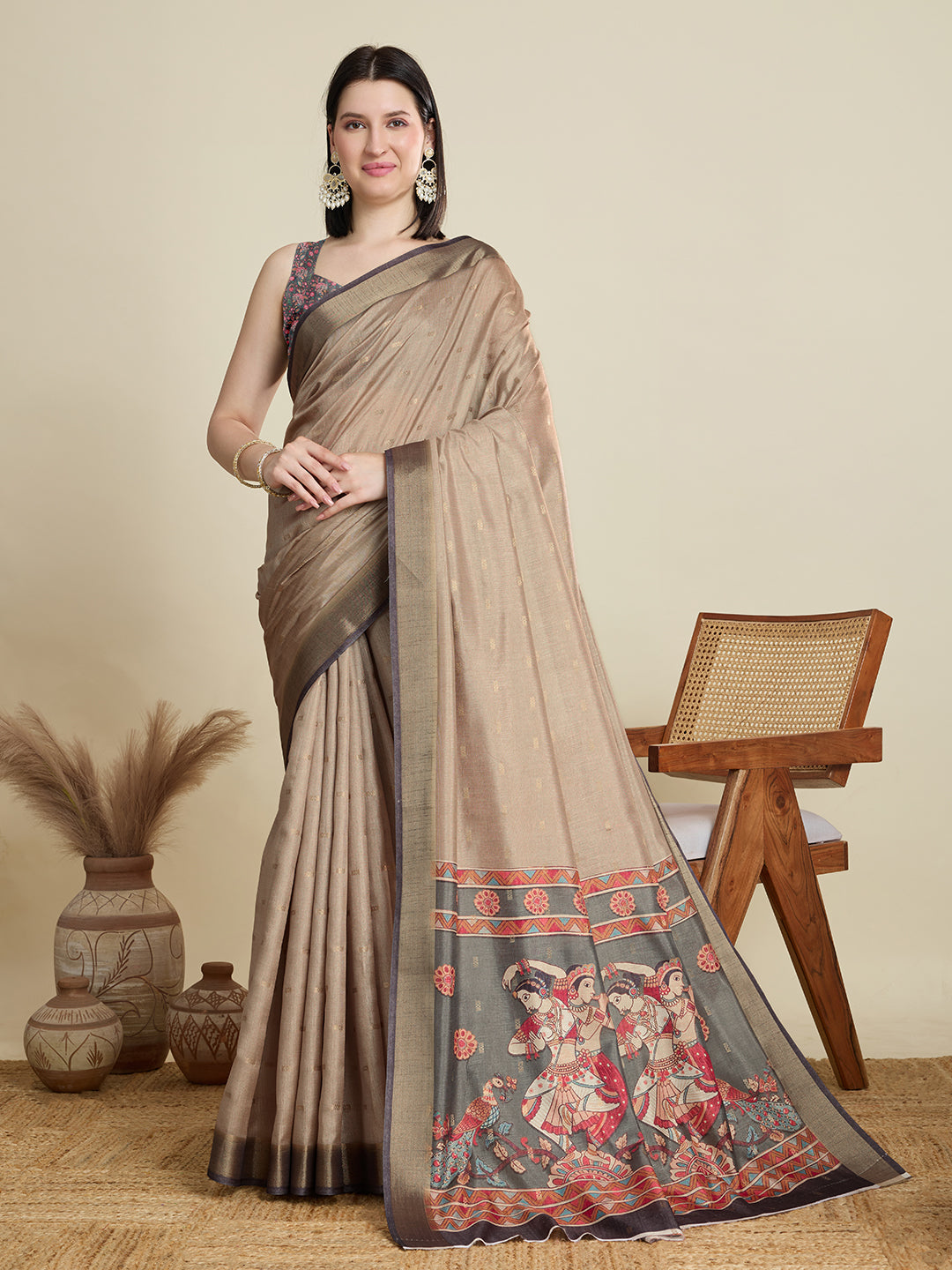 Stylish brown semi cotton saree featuring dancing girl butti, zari border and contrast blouse.