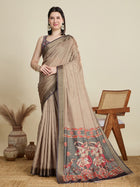 Stylish brown semi cotton saree featuring dancing girl butti, zari border and contrast blouse.