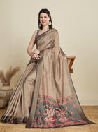 Stylish brown semi cotton saree featuring dancing girl butti, zari border and contrast blouse.