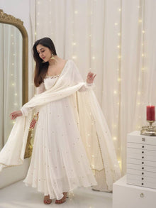 Graceful white anarkali salwar suit with subtle sequin work and dupatta – perfect for festive wear, weddings, or Eid looks.