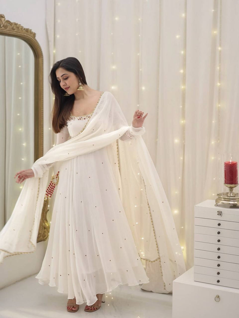 Graceful white anarkali salwar suit with subtle sequin work and dupatta – perfect for festive wear, weddings, or Eid looks.